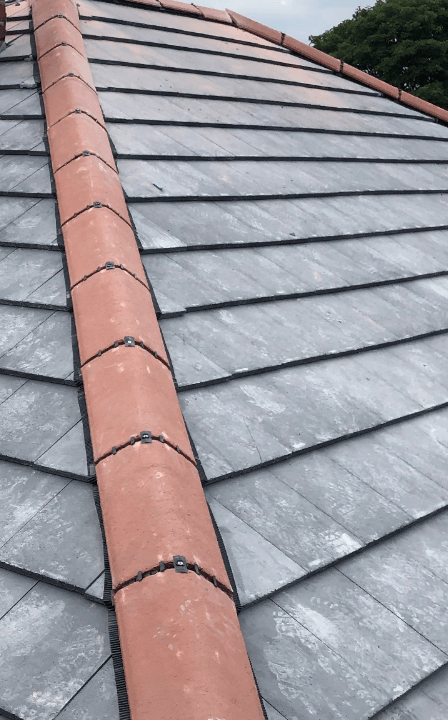 A picture of a new slate shingles roof installed by Roofers Cincinnati