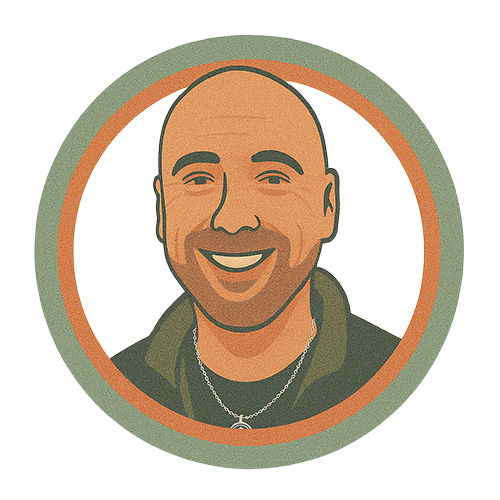 A bald man with a beard is smiling in a circle.