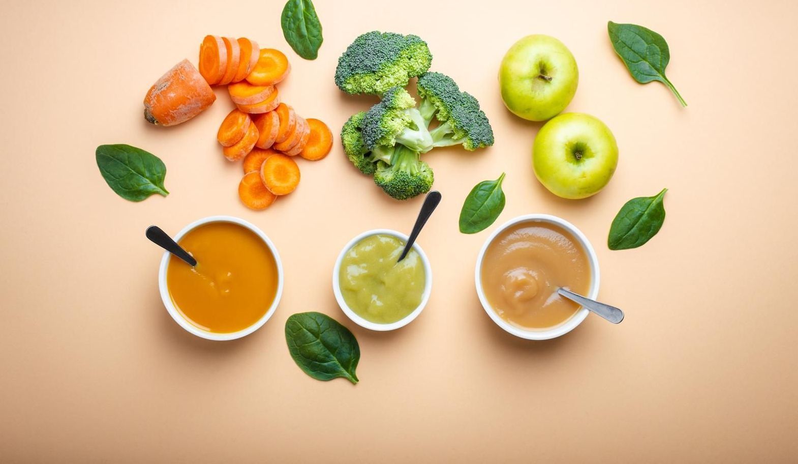 White bowls with healthy natural baby food on pastel background. Purees,  of fresh organic fruit veg