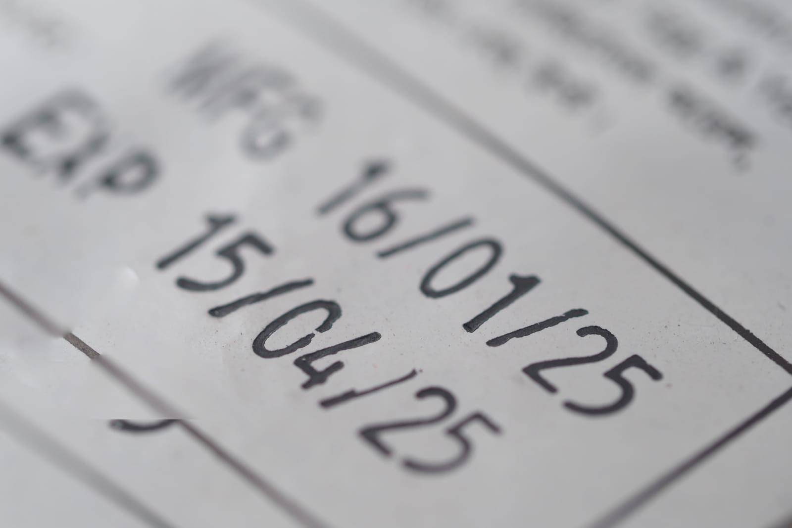 Detail of printed manufacturing and expiration dates on product packaging