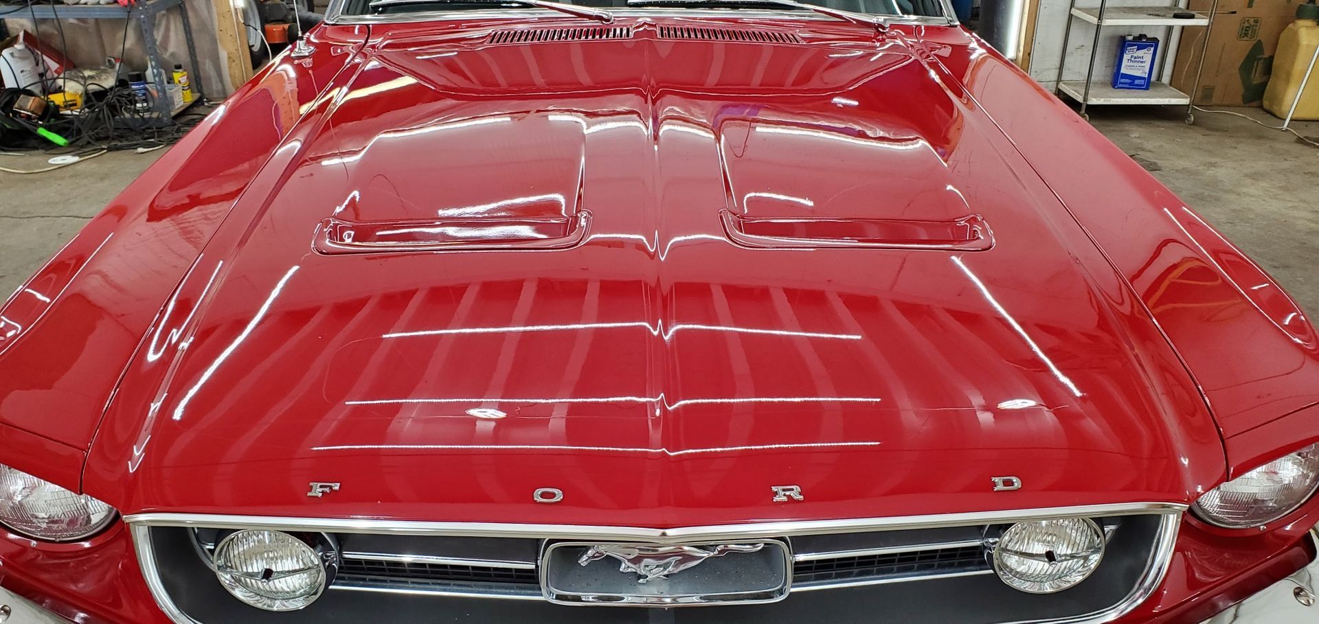 A blue lincoln mkx is parked in a showroom.