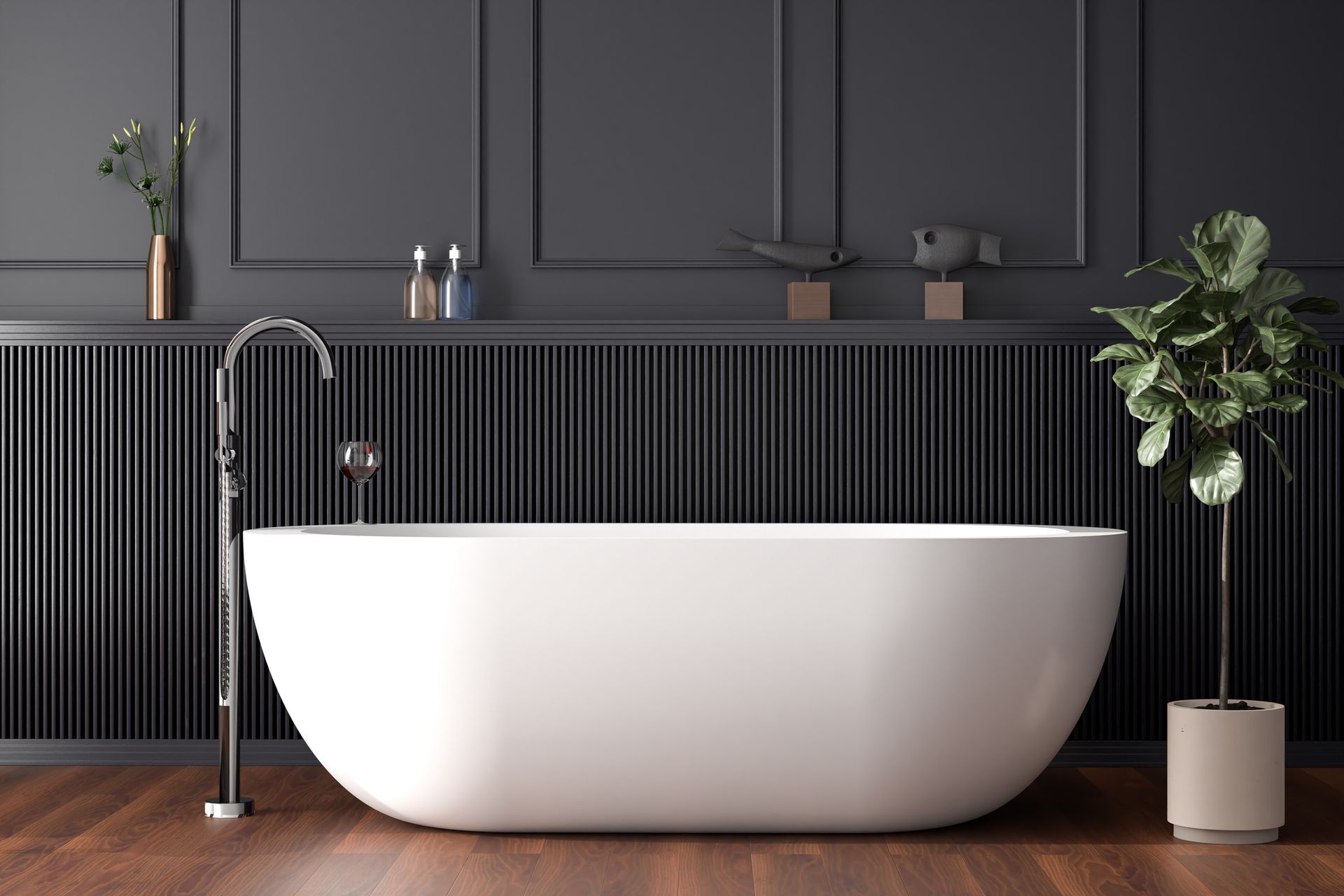 A white bathtub is sitting in a bathroom next to a plant.