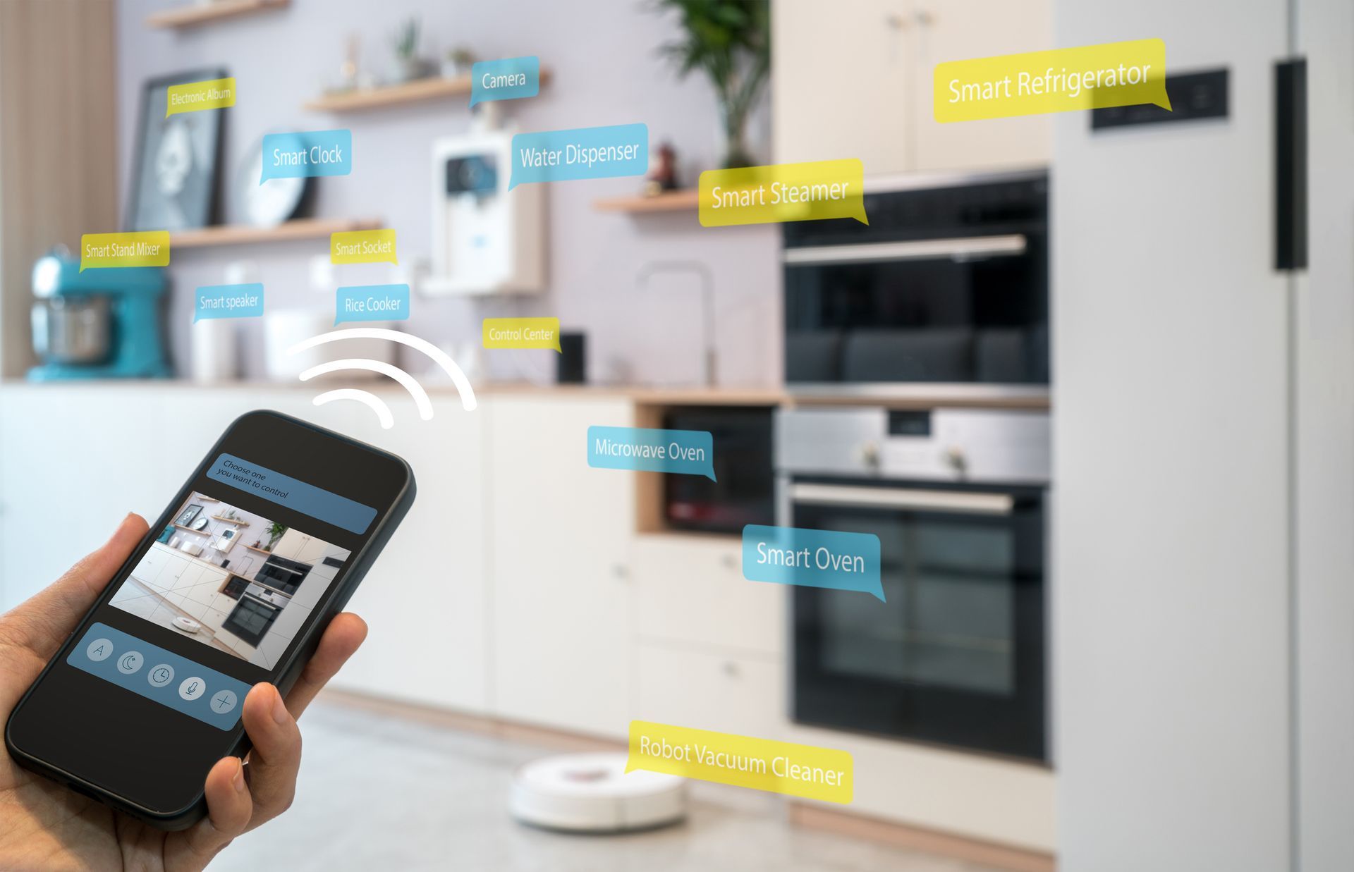 A person is holding a smart phone in their hand in a kitchen.