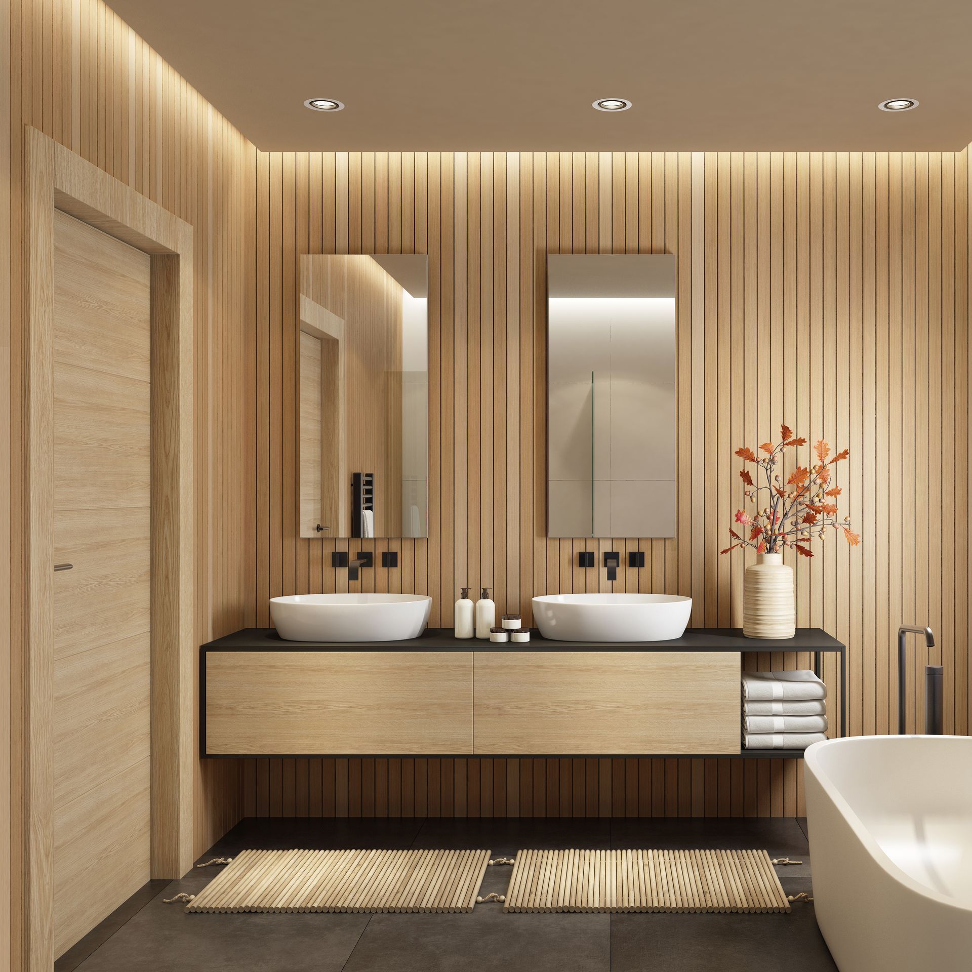 A bathroom with two sinks and a bathtub