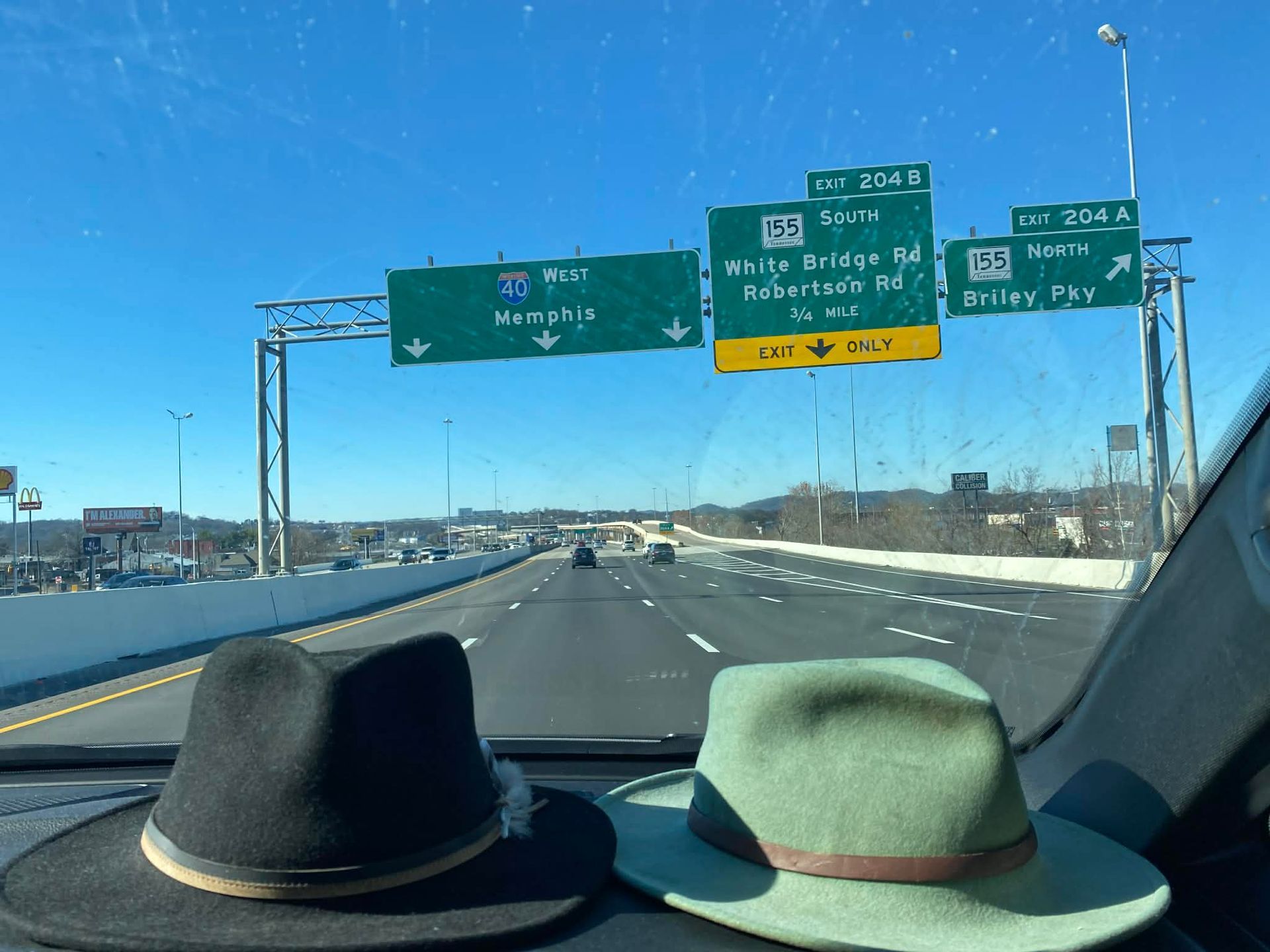 A view of the highway to Memphis through the rear view window of the car