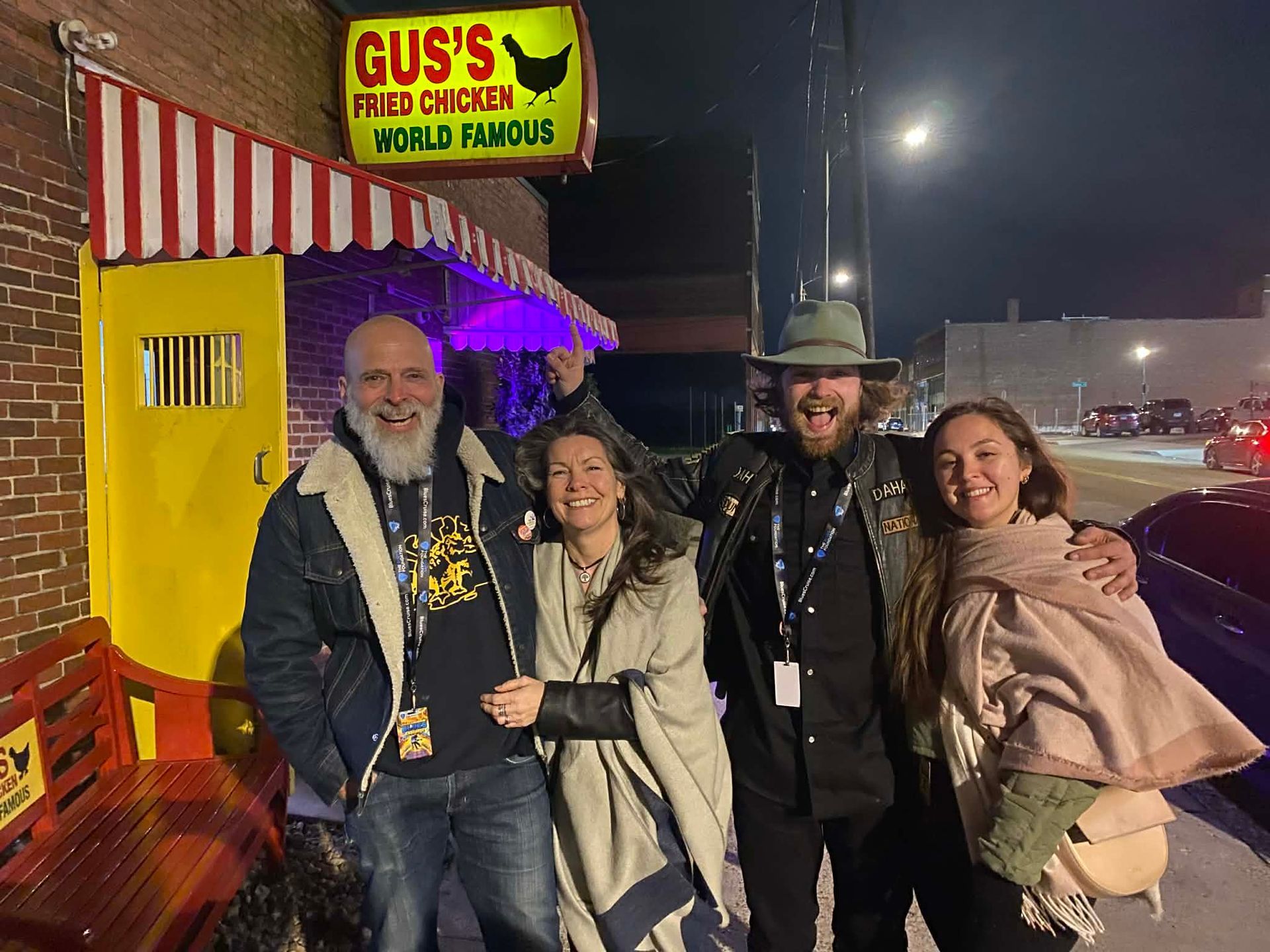 Father'n'Son and entourage posing in front of Gus' Famous Fried Chicken