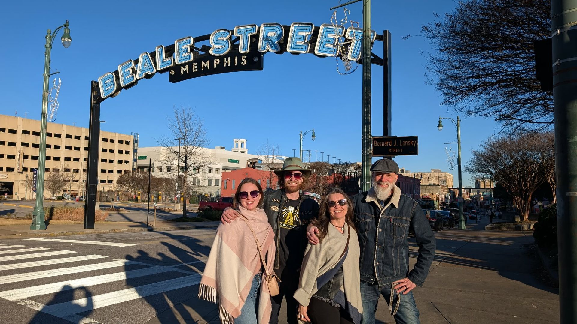 Father'n'Son and entourage posing in front of the Beale Street sign