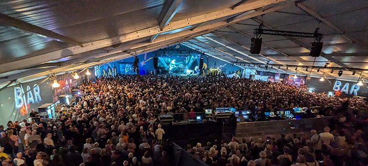 Hovigs Hangar - inside view of the main stage's large tent with a crowd of people