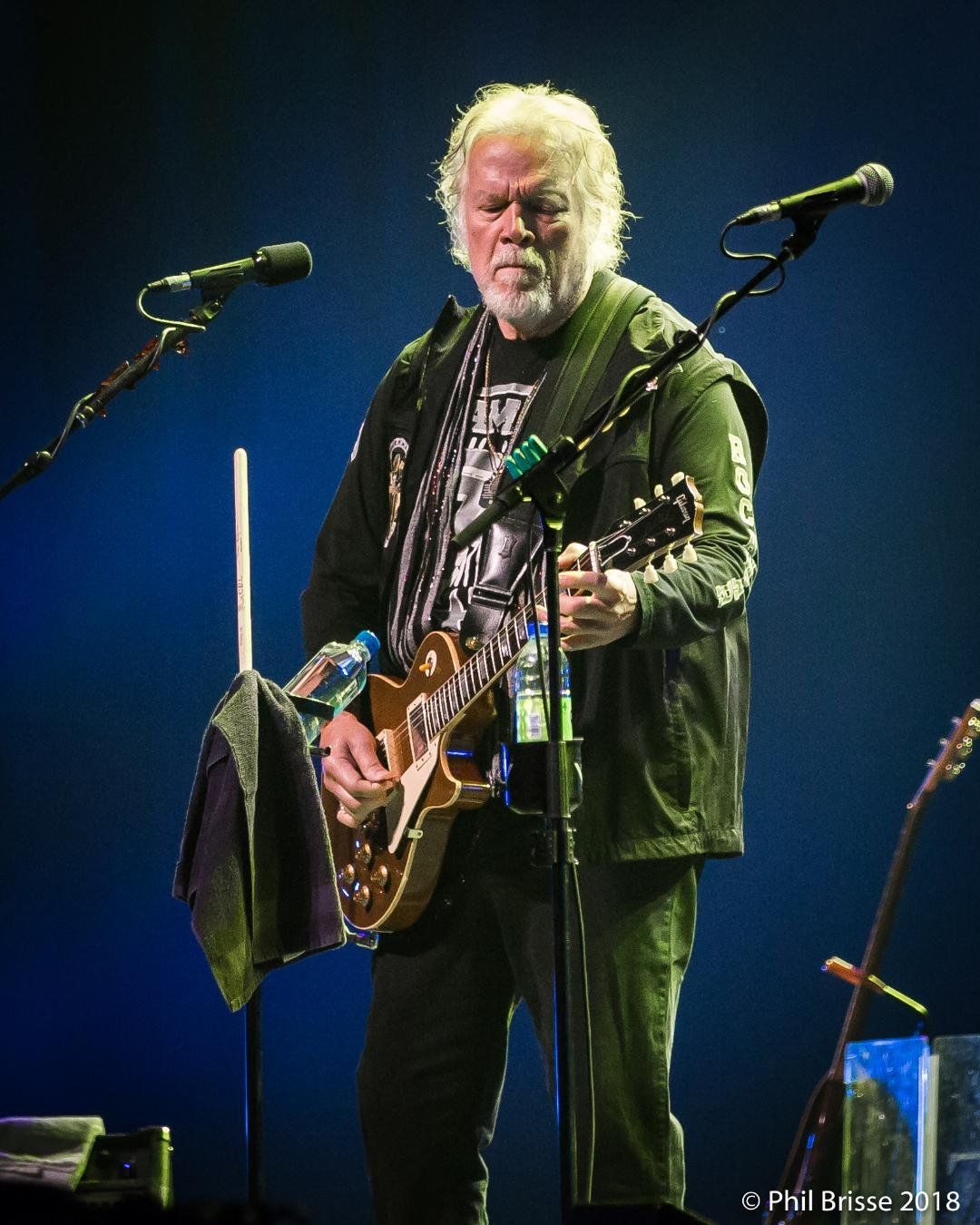 Randy Bachman on stage playing guitar