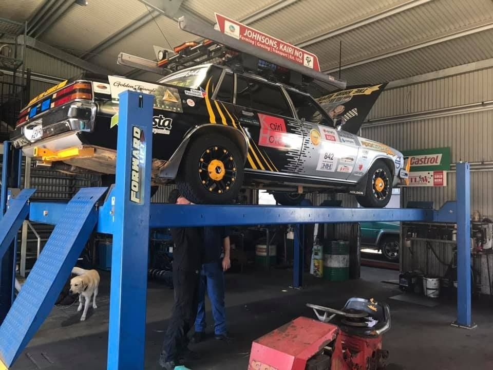 Car on a Lift in a Garage — Atherton Mechanical Services in Atherton, QLD