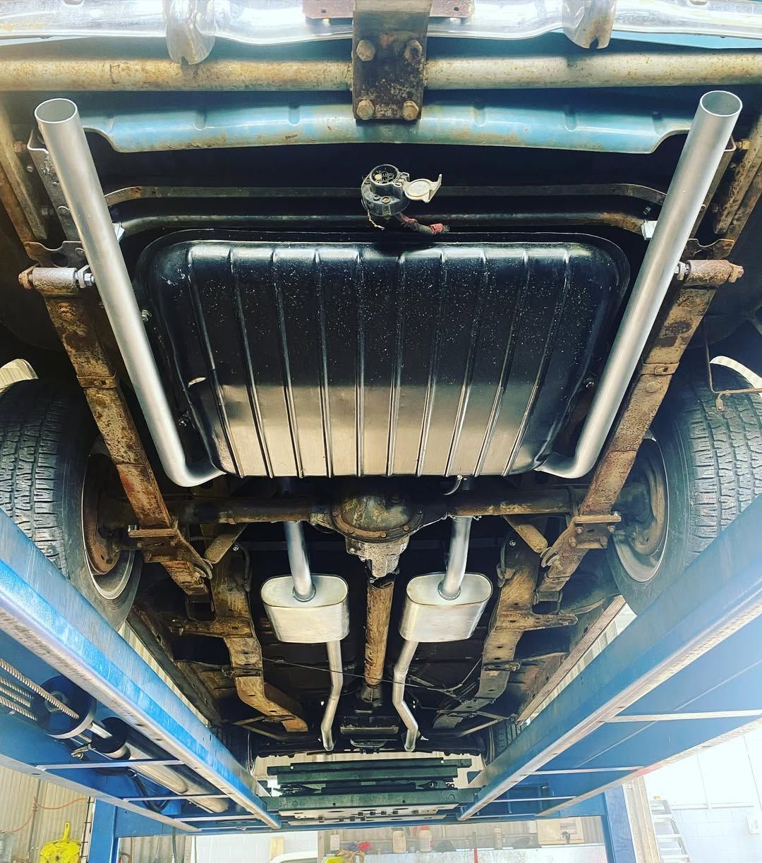 Underside View of an Old Car on a Lift — Atherton Mechanical Services in Atherton, QLD