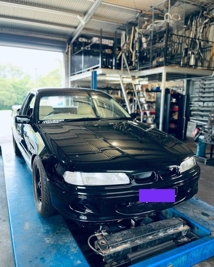 Black Car Inside a Garage — Atherton Mechanical Services in Atherton, QLD