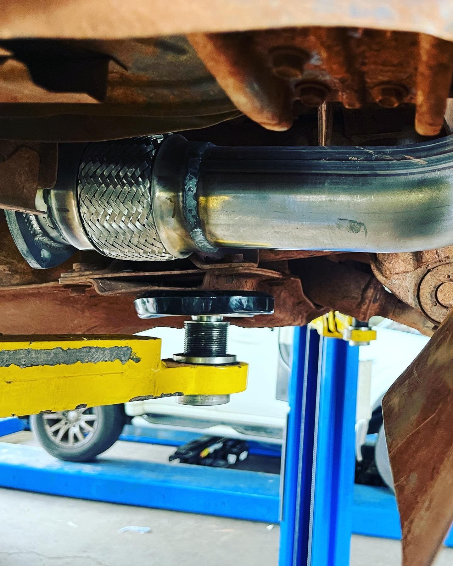 Undercarriage of a Vehicle With New Exhaust Flex Pipe Welded on — Atherton Mechanical Services in Innisfail, QLD