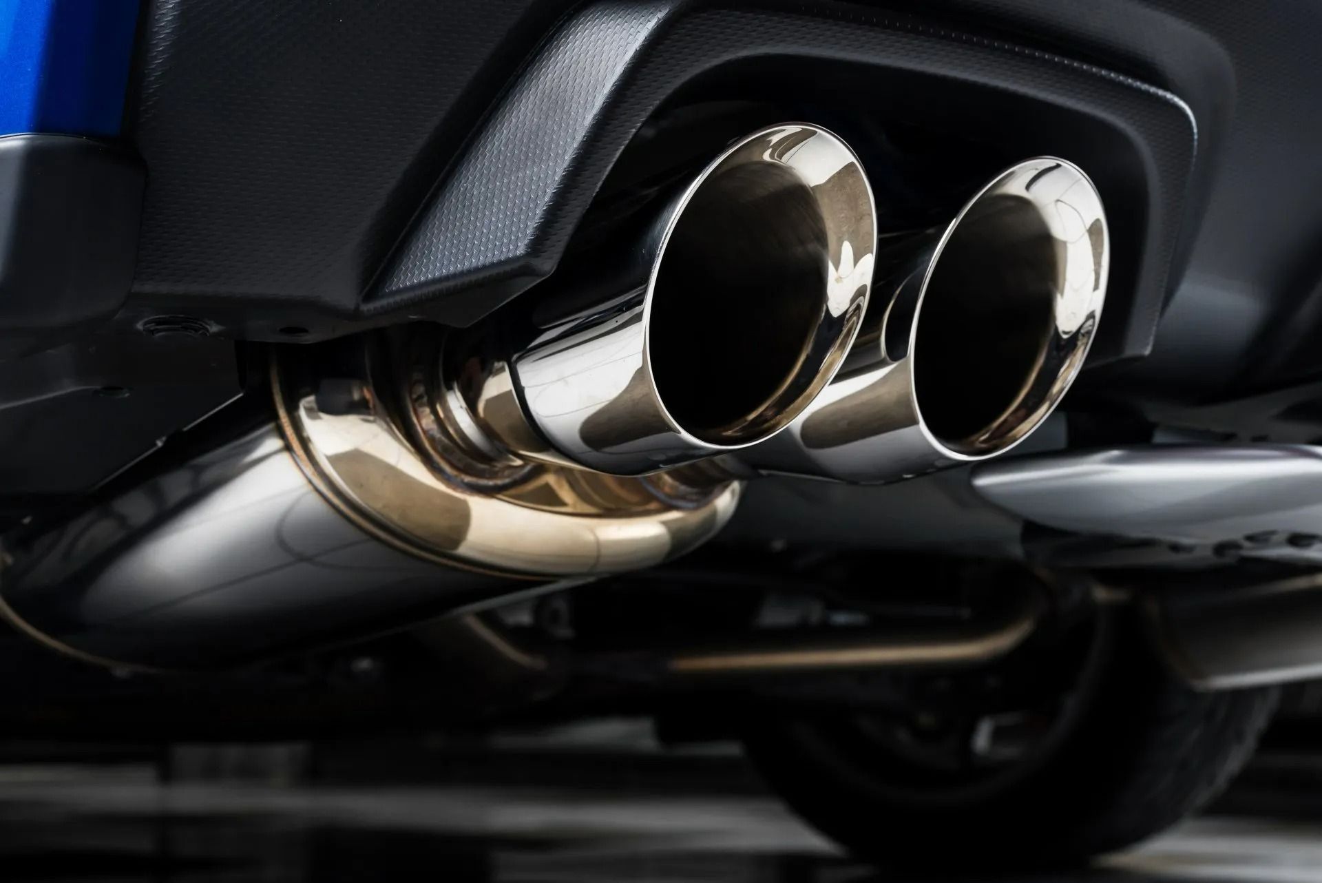 Shiny Chrome Exhaust Pipes on a Car — Atherton Mechanical Services in Atherton, QLD