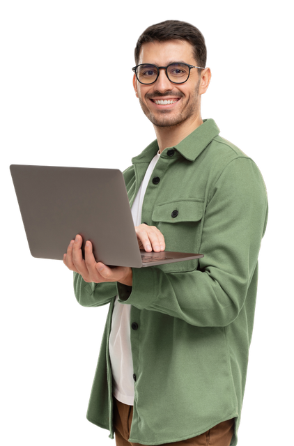 A Man In A Green Shirt Is Holding A Laptop Computer In His Hands