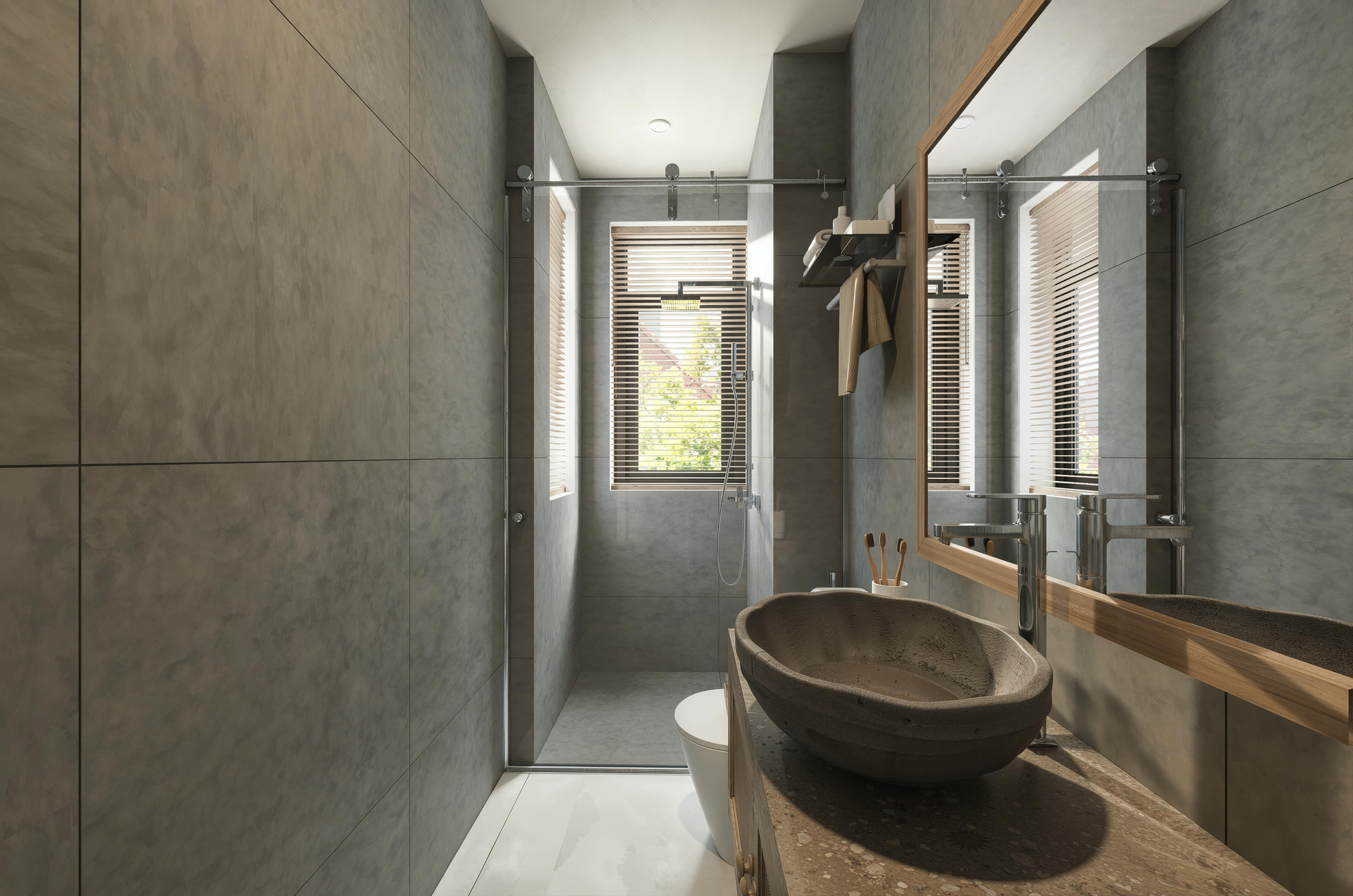 A modern bathroom with grey stone-tiled walls, a vessel sink on a textured vanity.
