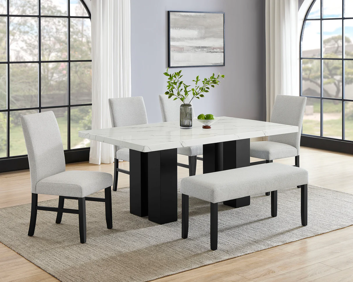 Dining set: White marble table, black base, upholstered chairs and bench on a rug.