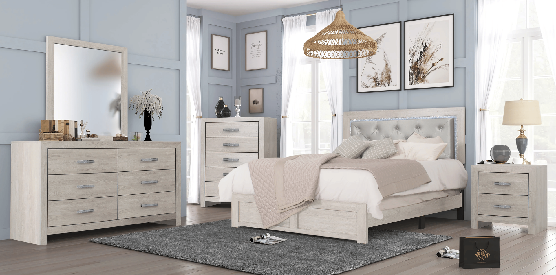 Bedroom furniture set in a blue and white room with a gray rug.