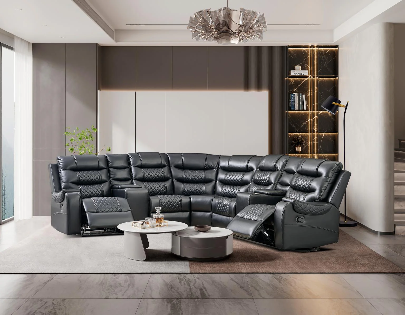 Black leather sectional sofa with recliners in a modern living room.