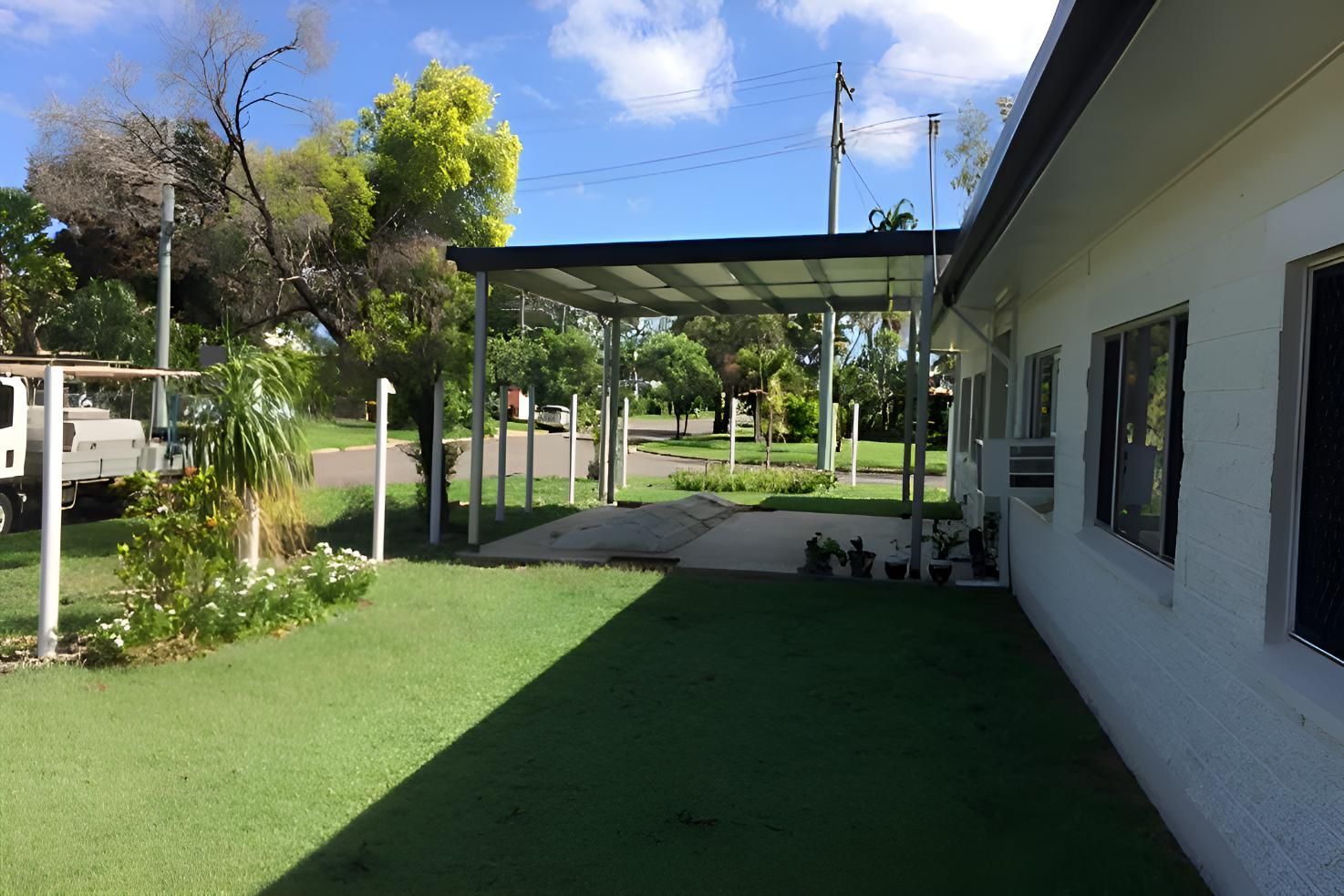 A White House With A Carport In Front Of It — Shedquarters In Kirwan, QLD