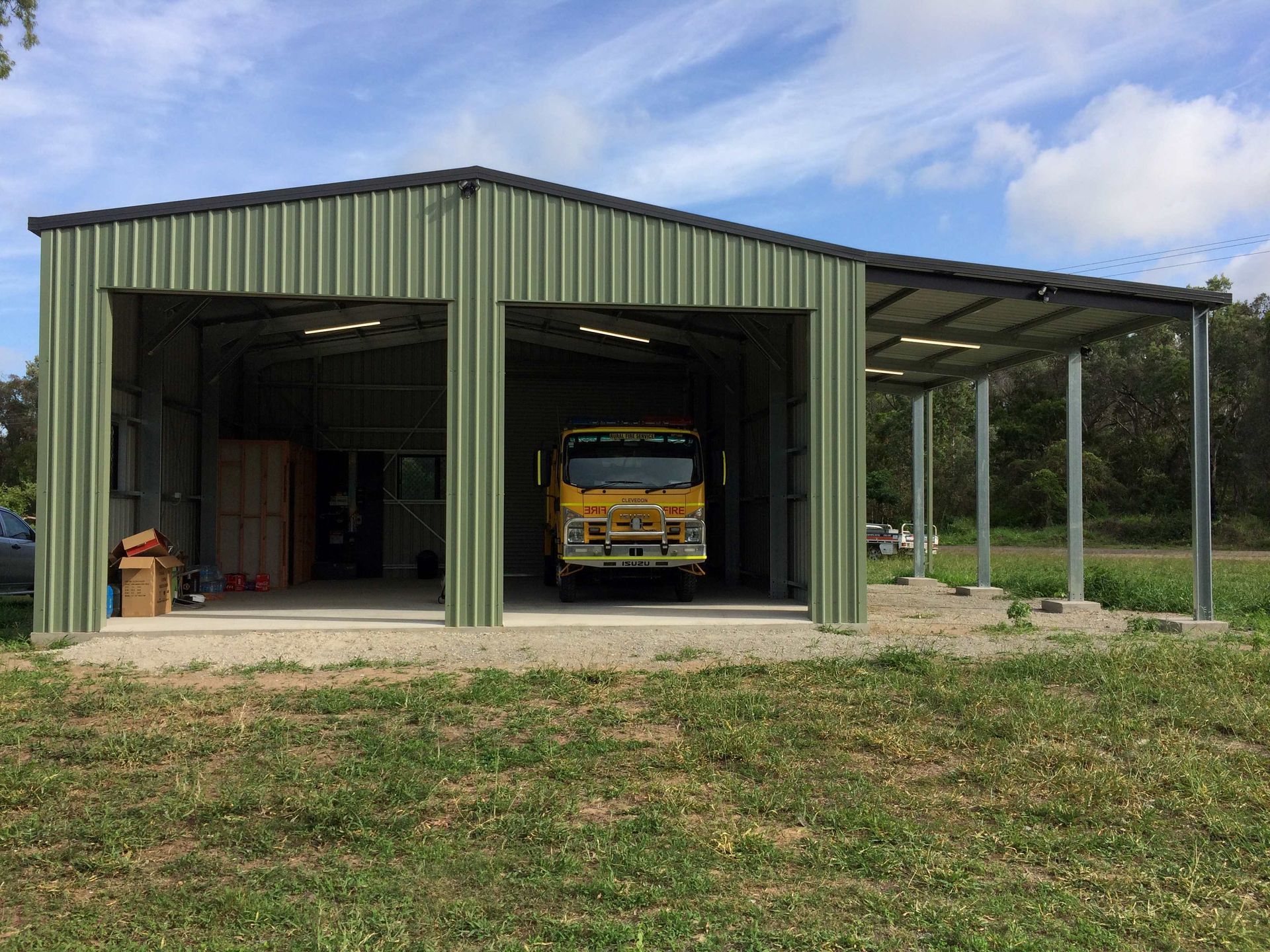 Two Cars Are Parked in Front of a House With a Carport — Shedquarters In Kirwan, QLD