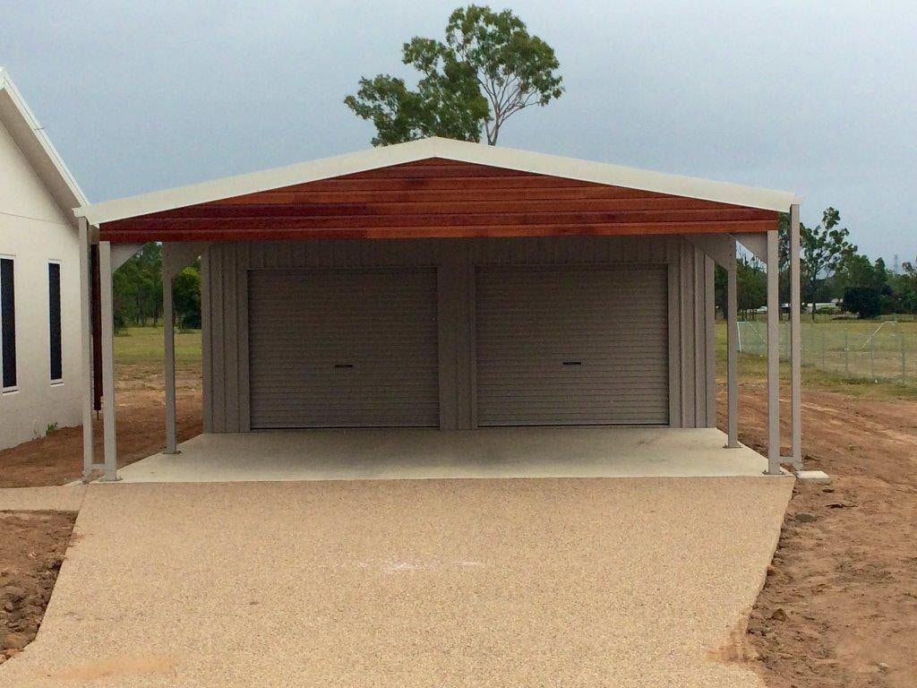A Garage With a Wooden Roof and a Driveway — Shedquarters In Kirwan, QLD