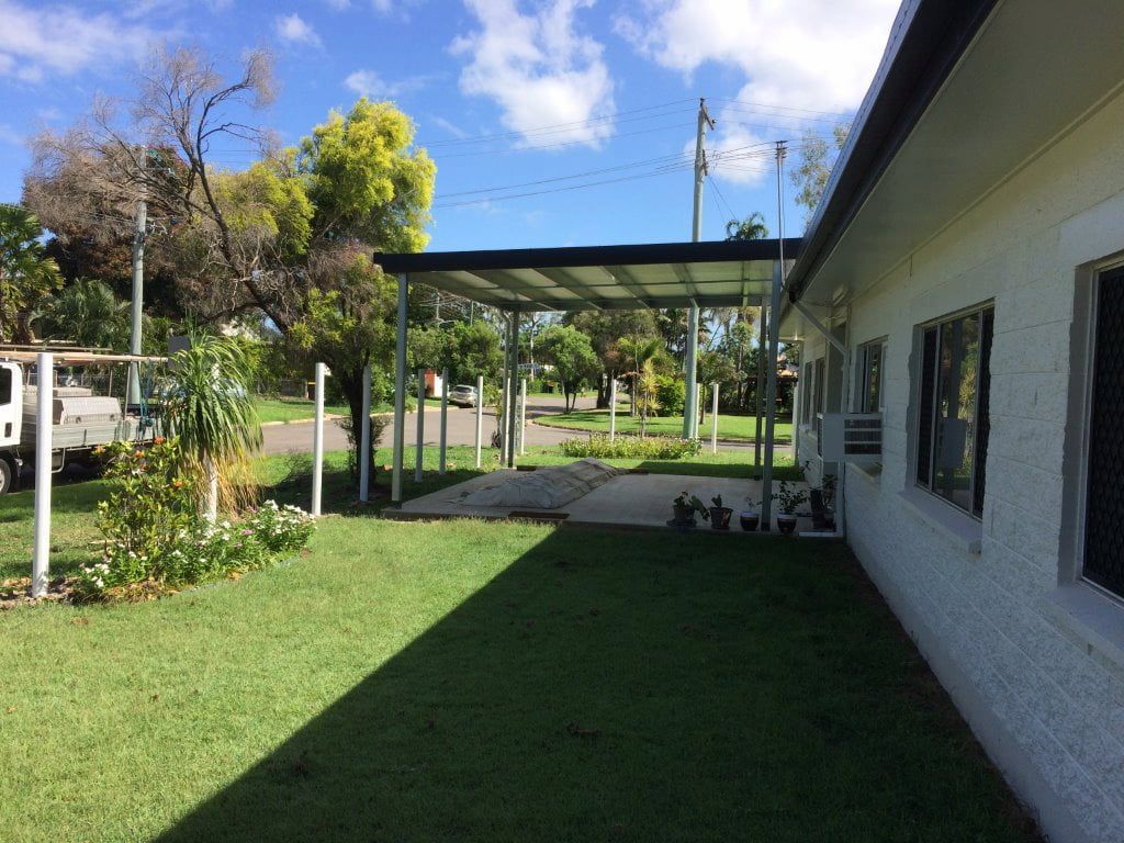 A White House With a Carport in the Backyard — Shedquarters In Kirwan, QLD