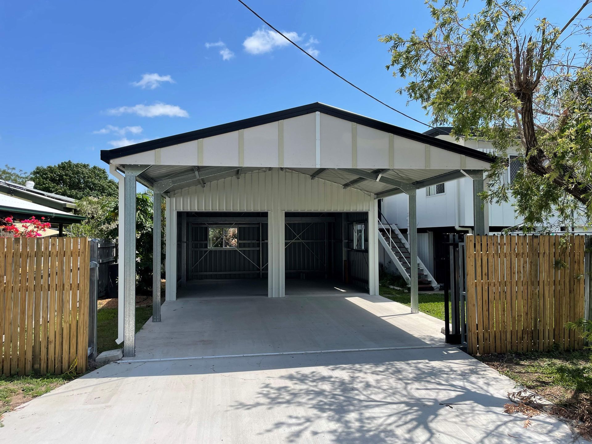A Large Building Is Being Built In The Middle Of A Dirt Field — Shedquarters In Kirwan, QLD