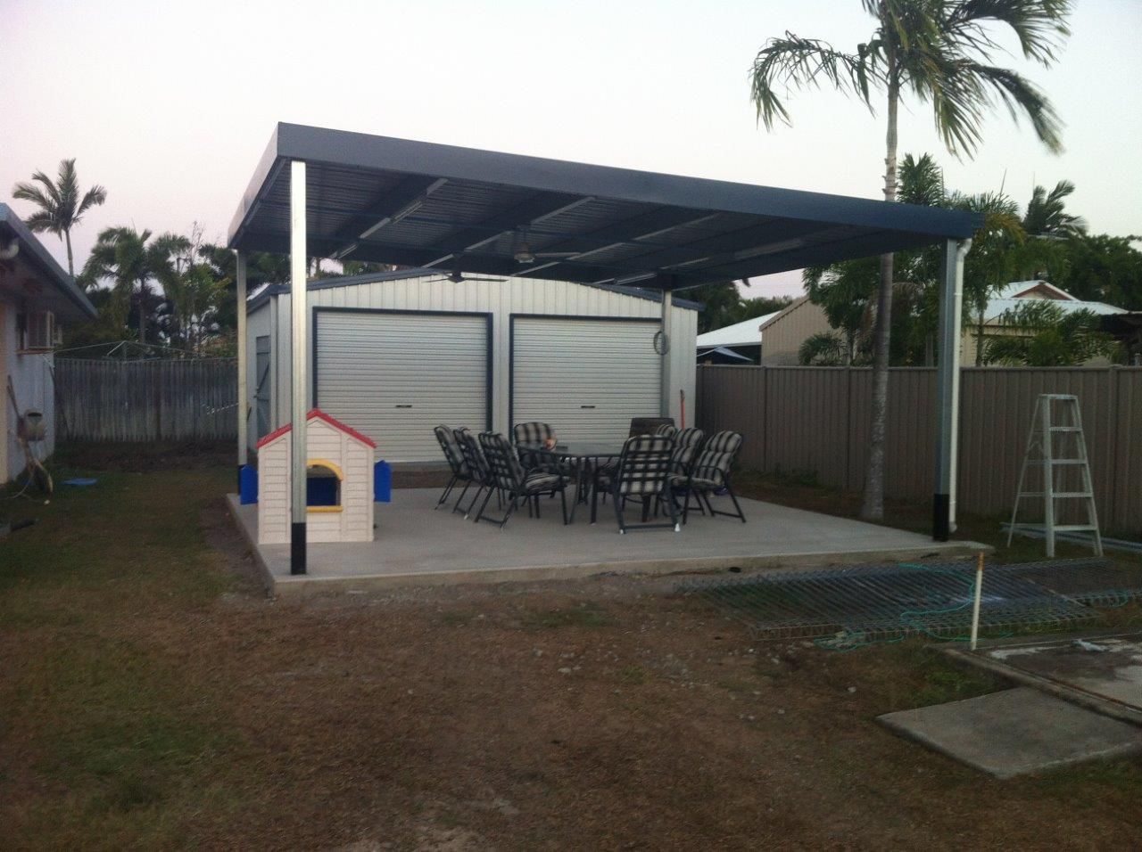 An Artist 's Impression Of A House With A Covered Patio — Shedquarters In Kirwan, QLD