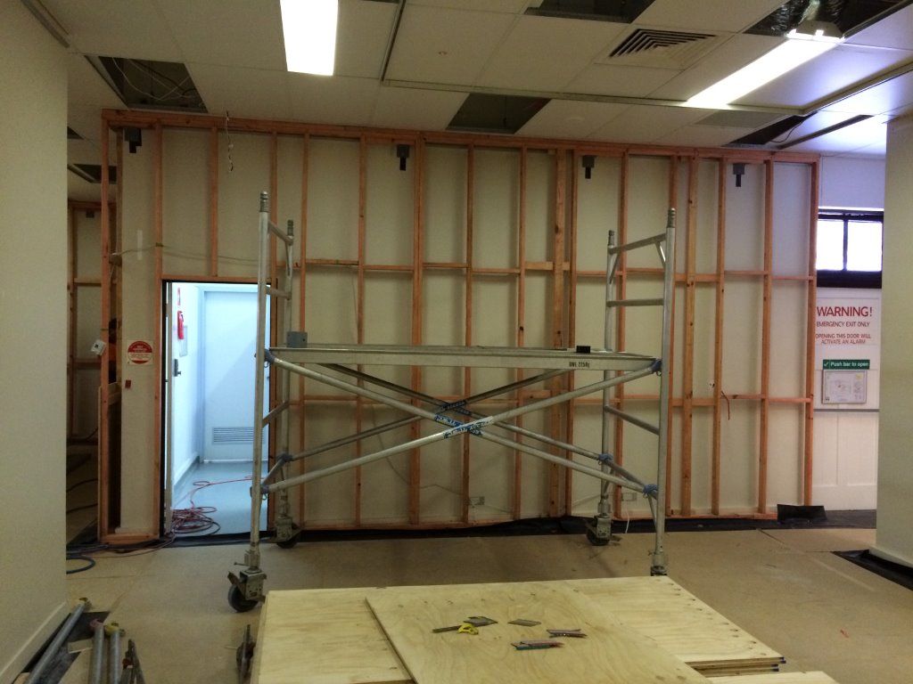 An Empty Room With a Scaffolding in the Middle of It — Shedquarters In Kirwan, QLD