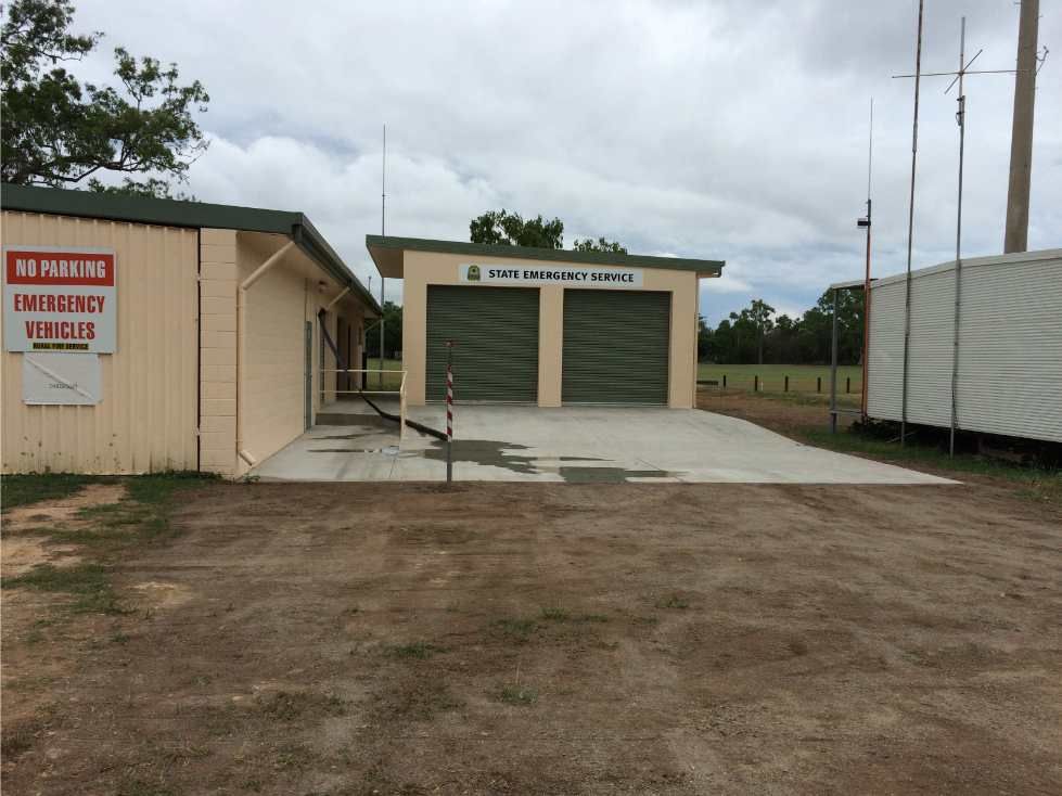 A Building With a Sign That Says Emergency Vehicles — Shedquarters In Kirwan, QLD