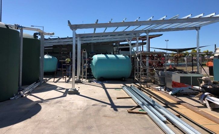 A Building Under Construction With a Lot of Tanks and Pipes — Shedquarters In Kirwan, QLD