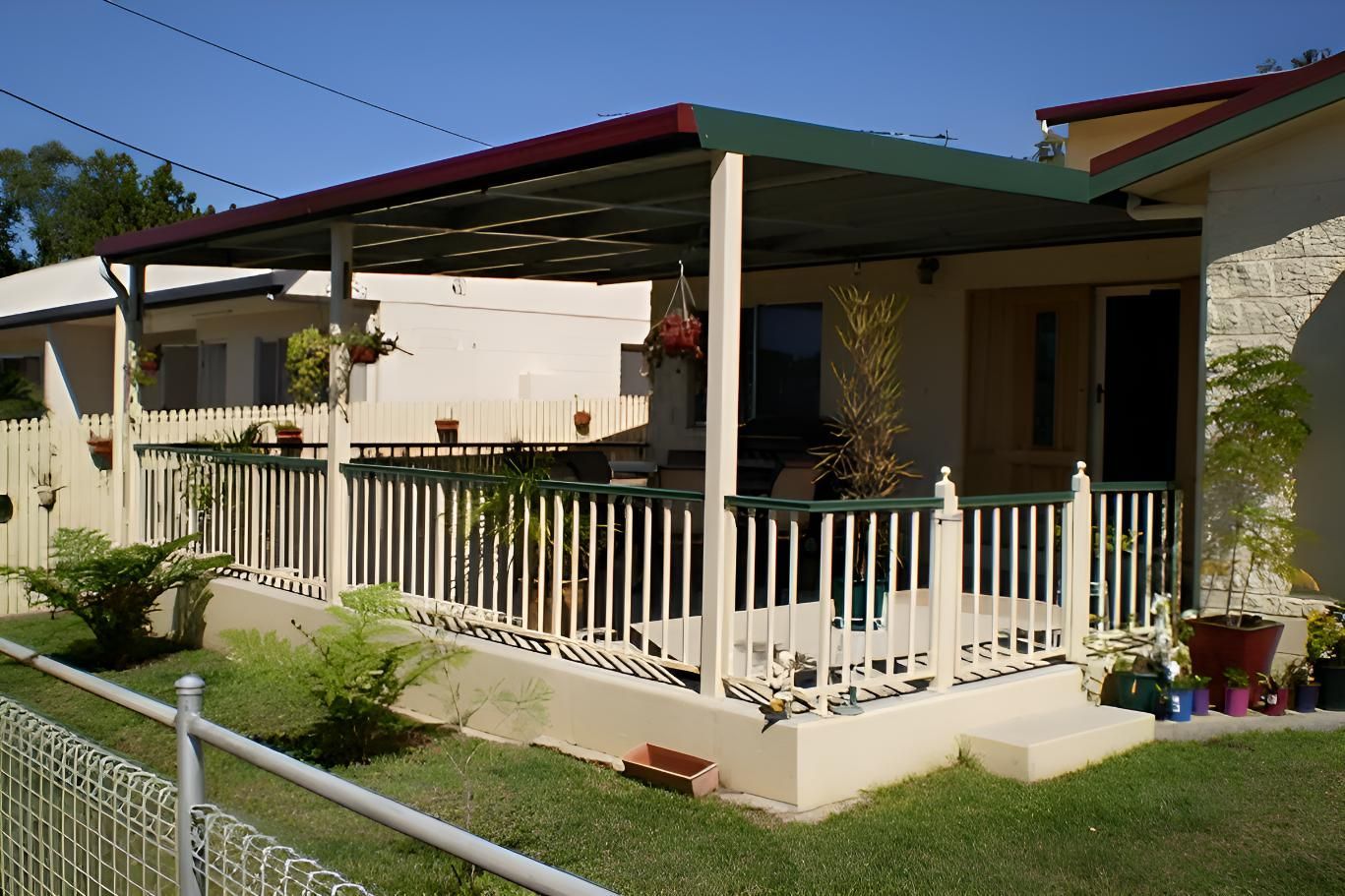 A House With A Porch And A Fence In Front Of It — Shedquarters In Kirwan, QLD