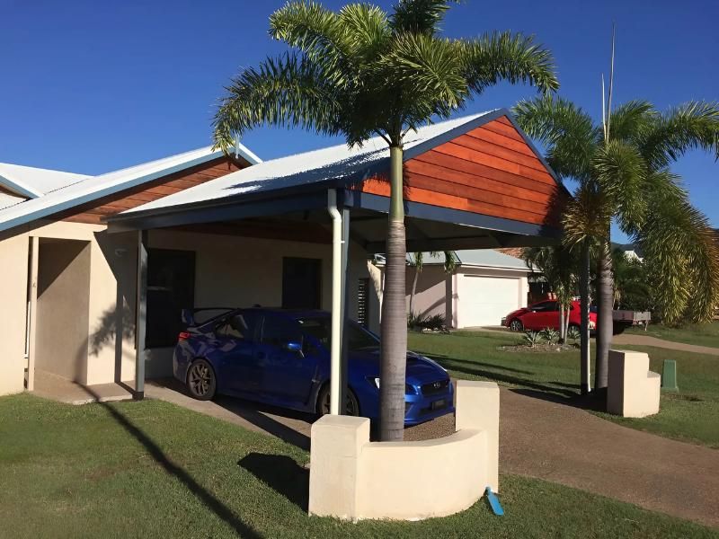 A Blue Car Is Parked Under A Canopy In Front Of A House — Shedquarters In Kirwan, QLD