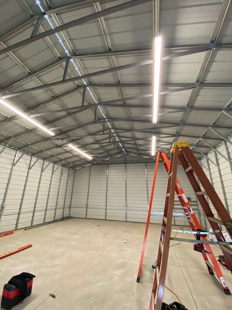 A Large Warehouse With a Ladder — Bullhead City, AZ — River City Electrical Contracting