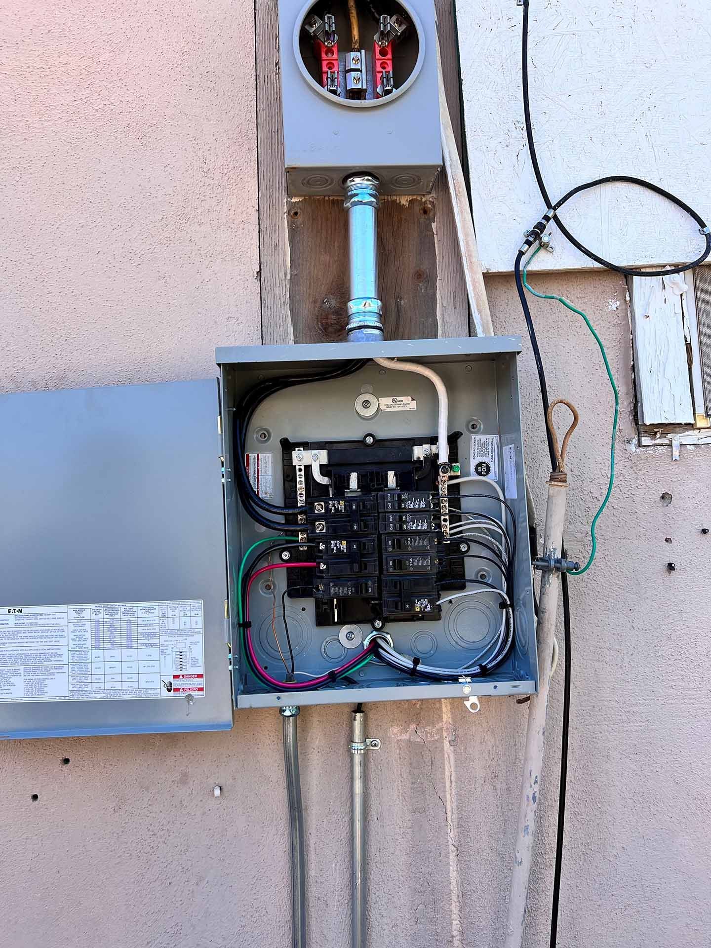 Electrical Box Attached to the Side of a Building — Bullhead City, AZ — River City Electrical Contracting