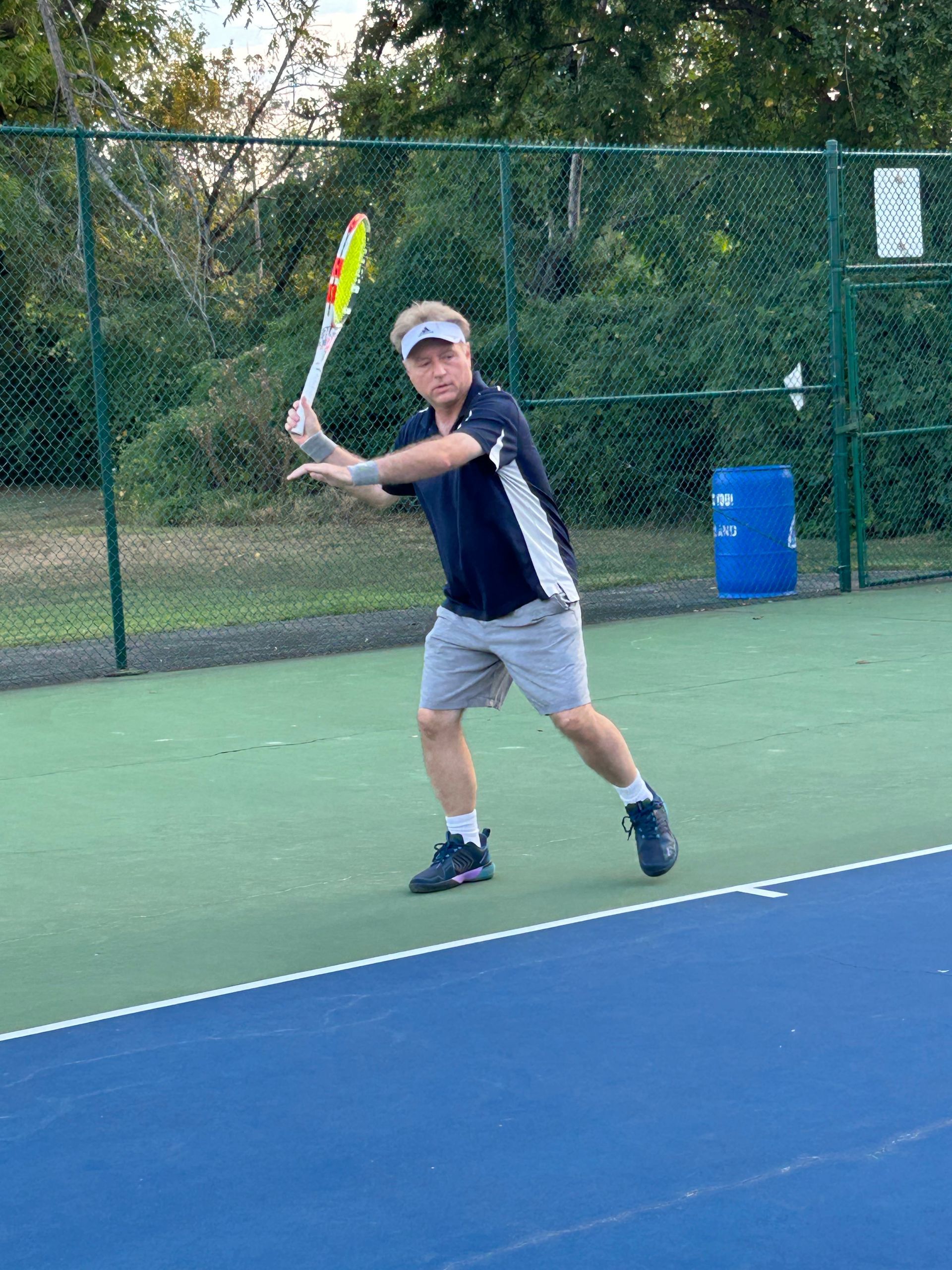 Mark Miller, PhD., Founder of Gobi Grip, on the tennis court, forehand