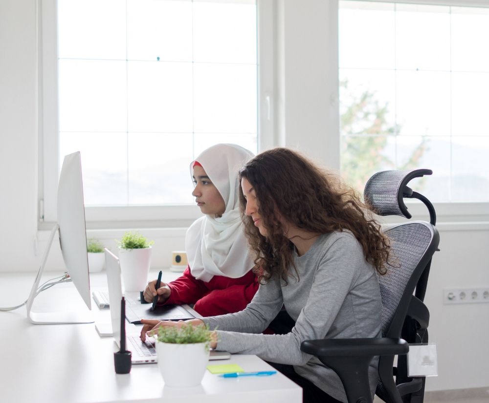 Two Girls Working on Computer — Minneapolis, MN — International Translation Solutions