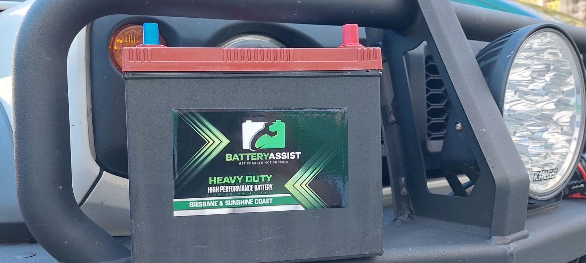 Black Car Battery With Green Label — Battery Assist Brisbane in Caboolture, QLD