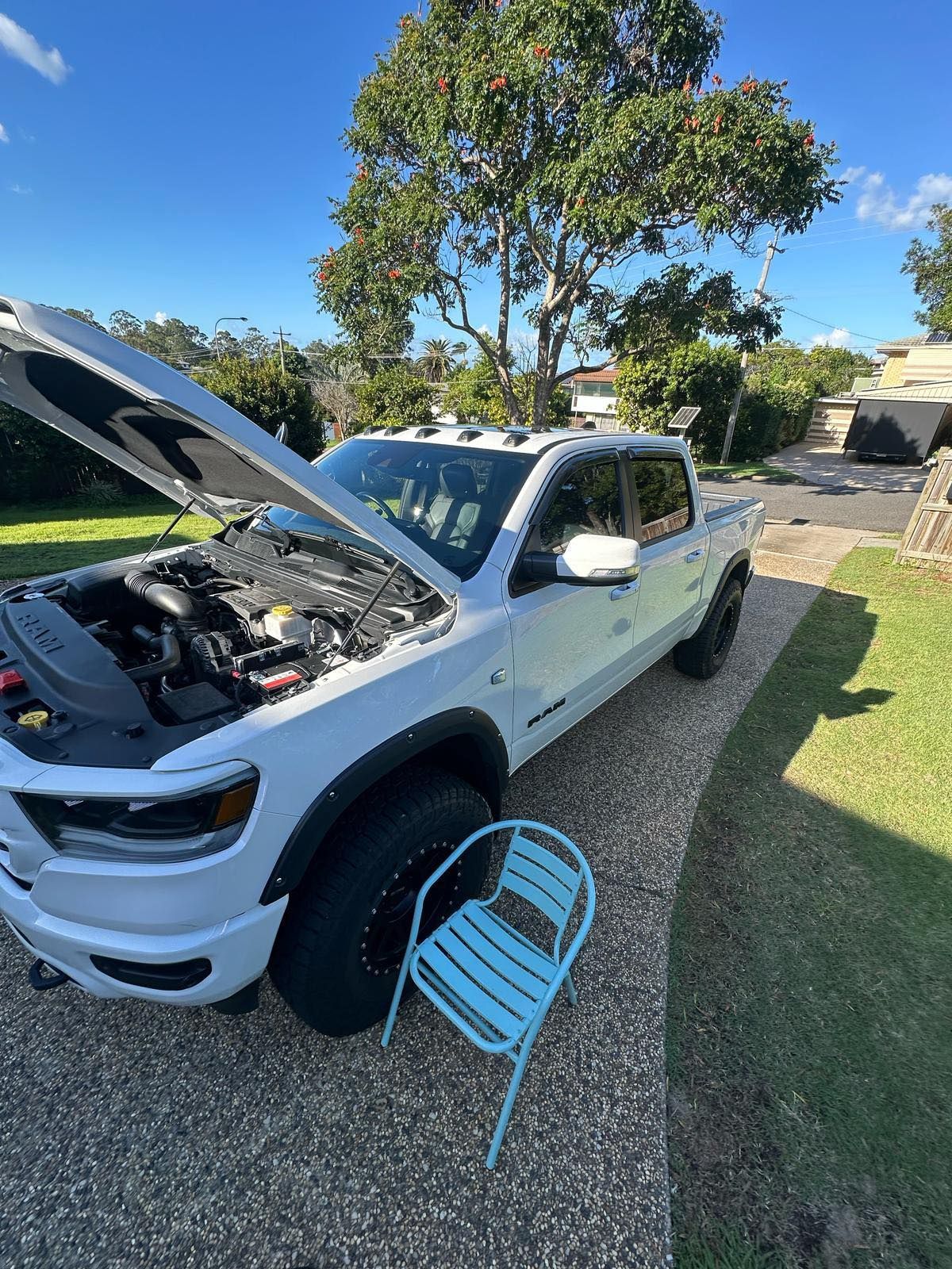 White Pickup Truck With Hood Up on a Driveway — Battery Assist Brisbane in North Lakes, QLD