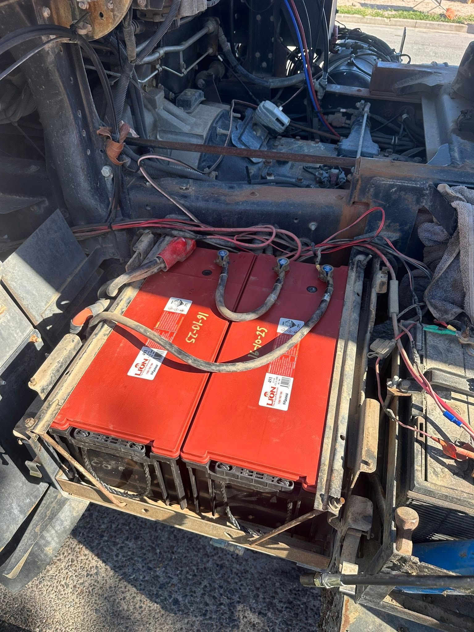 Two Red Batteries With Connected Wires — Battery Assist Brisbane in Caboolture, QLD