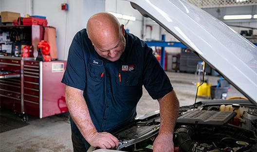 Mechanic Working on Engine Bay | B & B Auto Repair