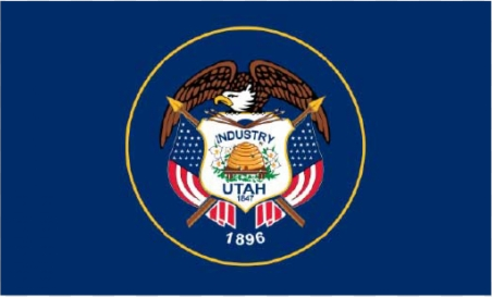 A group of men are sitting around a table reading books and drinking coffee.