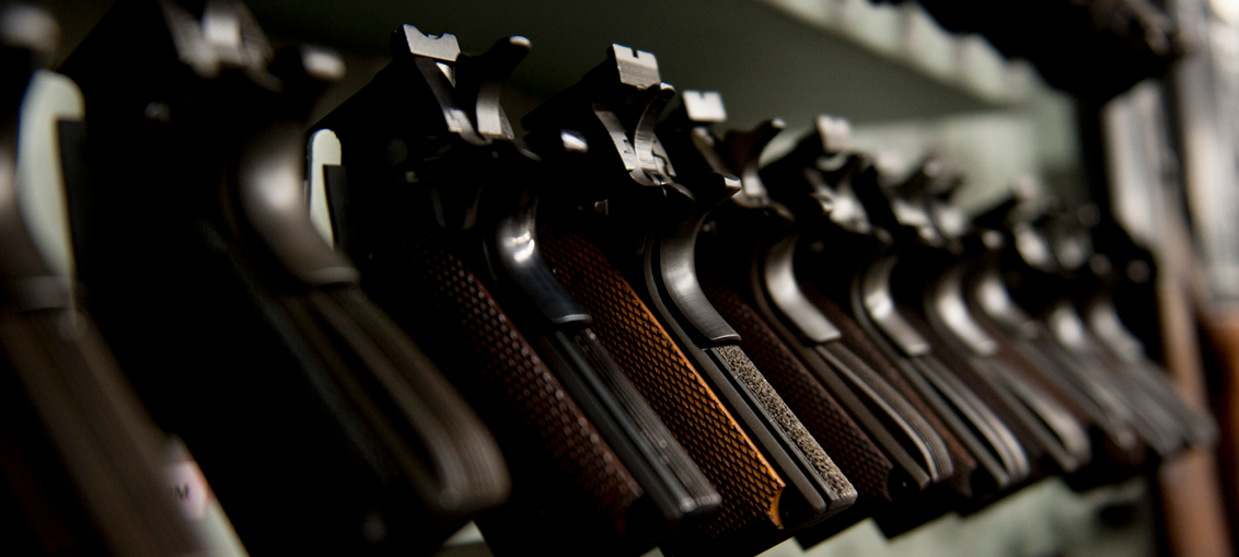 A group of young people are posing for a picture together and smiling.