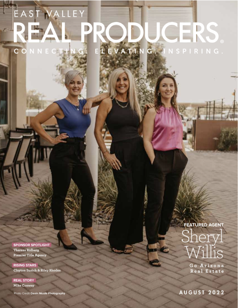 Three women are standing next to each other on the cover of a magazine.