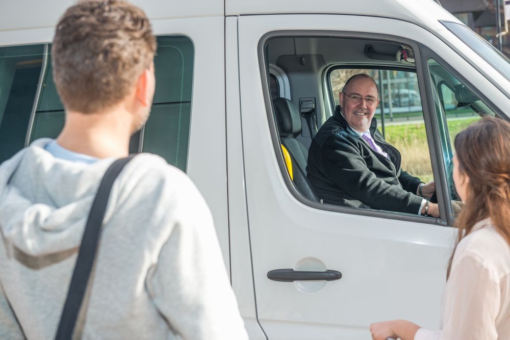 A man is talking to a woman in front of a white van. — Drink Drivers Hervey Bay in Urangan, QLD