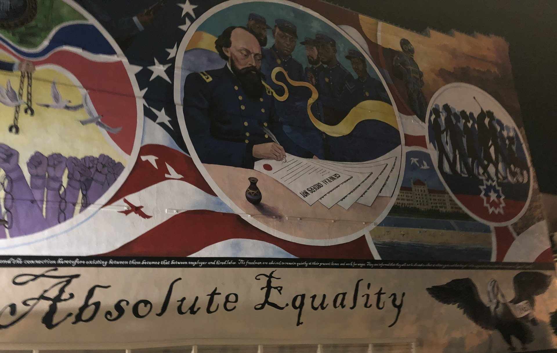 Juneteenth mural with army general,  Black American  soldiers, and formerly enslaved people