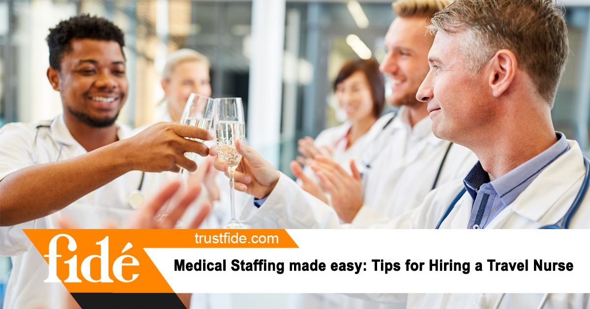 A group of doctors and nurses toasting with champagne