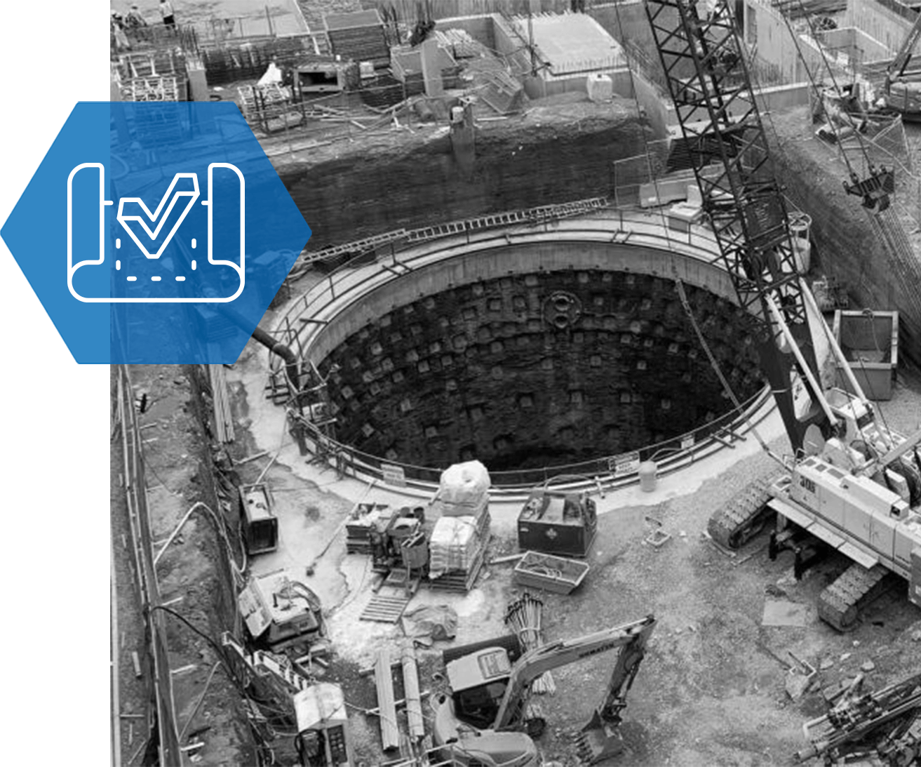 An aerial view of a construction site with a blue check mark.