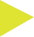 A close up of a yellow triangle on a white background.